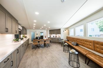 A modern office space with wooden floors and furniture.